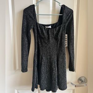 **NEW WITH TAGS** Sparkly, black, long sleeve romper from Urban Outfitters